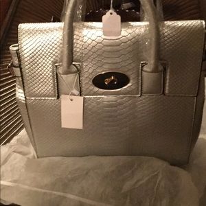 Silver handbag that also wears as a backpack